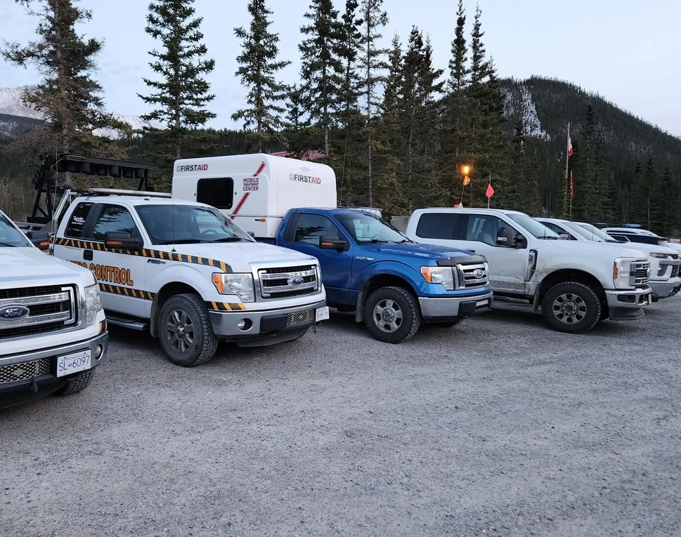 A group of trucks parked in the parking lot.