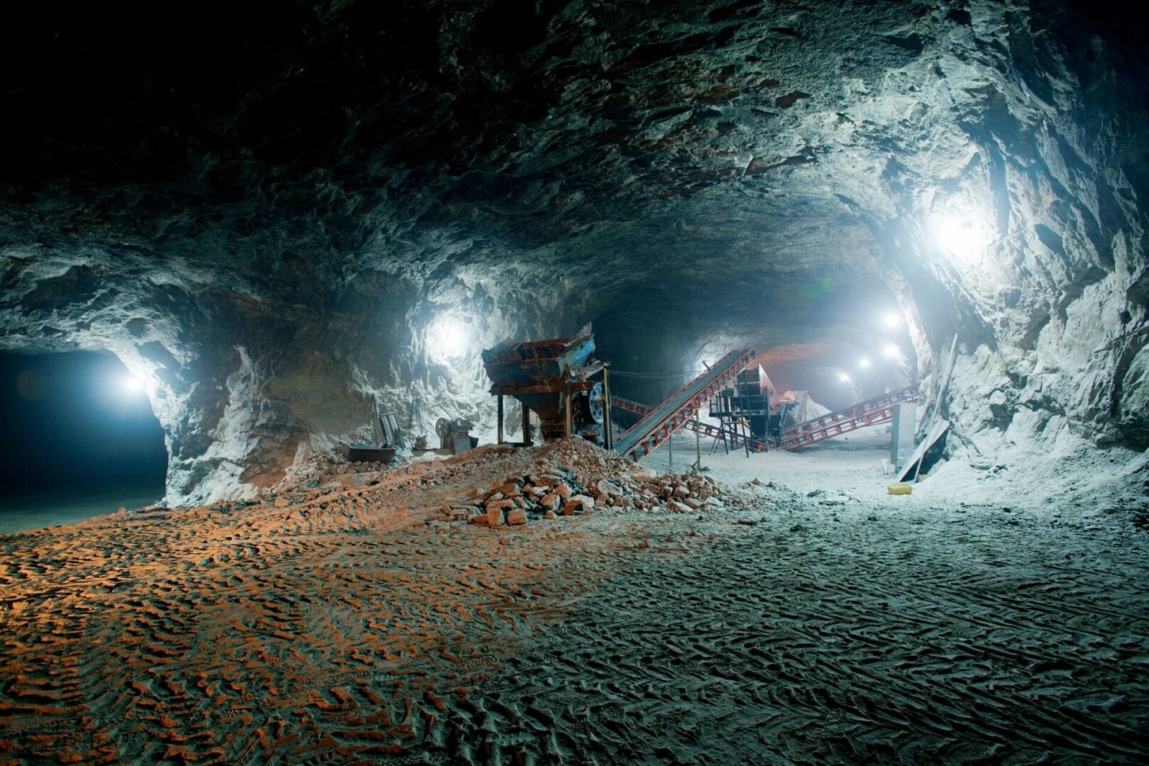 A group of people in an underground cave.